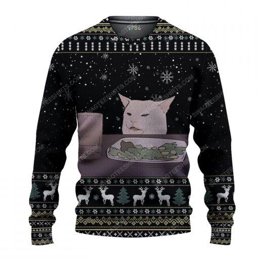 Two women yelling at a cat ugly christmas sweater 1
